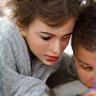 Teacher helping student